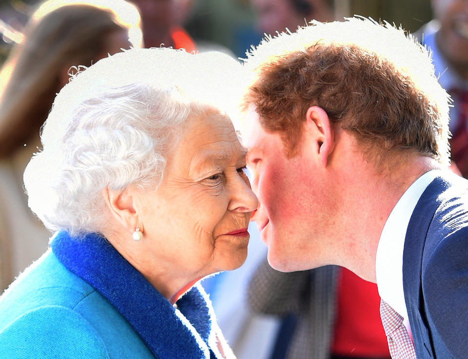 The Queen and Prince Harry kiss on the cheek