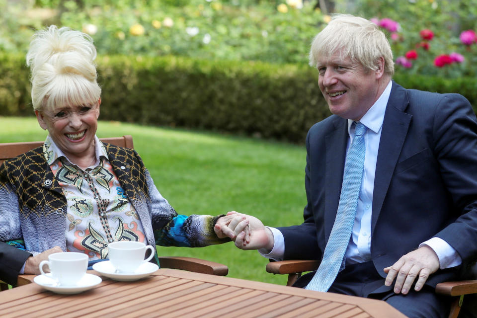 LONDON, ENGLAND - SEPTEMBER 02: Prime Minister Boris Johnson has a cup of tea with television actress Dame Barbara Windsor during a meeting in London on September 2, 2019 in London, England. Barbara Windsor, who suffers from Alzheimers, met with the Prime Minister at 10 Downing Street to discuss dementia care. (Photo by Simon Dawson - WPA Pool/Getty Images)