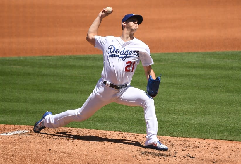 Dodgers pitcher Walker Buehler throws a pitch against the Giants.
