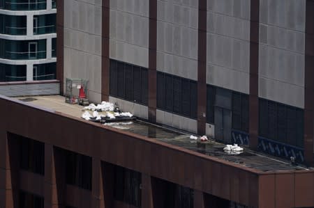 Debris is pictured on 787 7th Ave a day after a helicopter crashed into the building in New York City