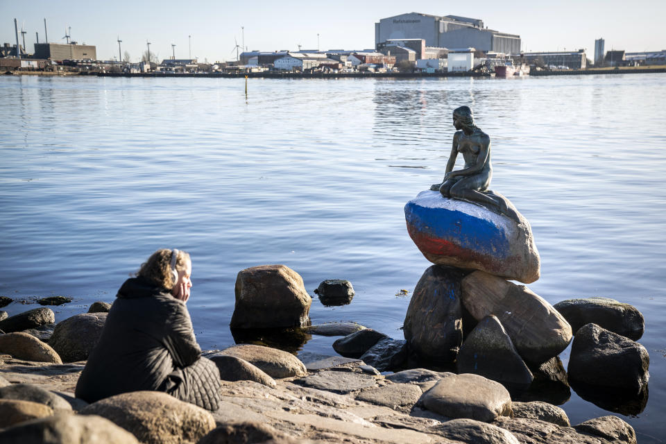 The Russian flag is painted on the stone where the Little Mermaid sits on, after the sculpture was vandalized, in Copenhagen, Denmark, Thursday, March 2, 2023. (Ida Marie Odgaard/Ritzau Scanpix via AP)