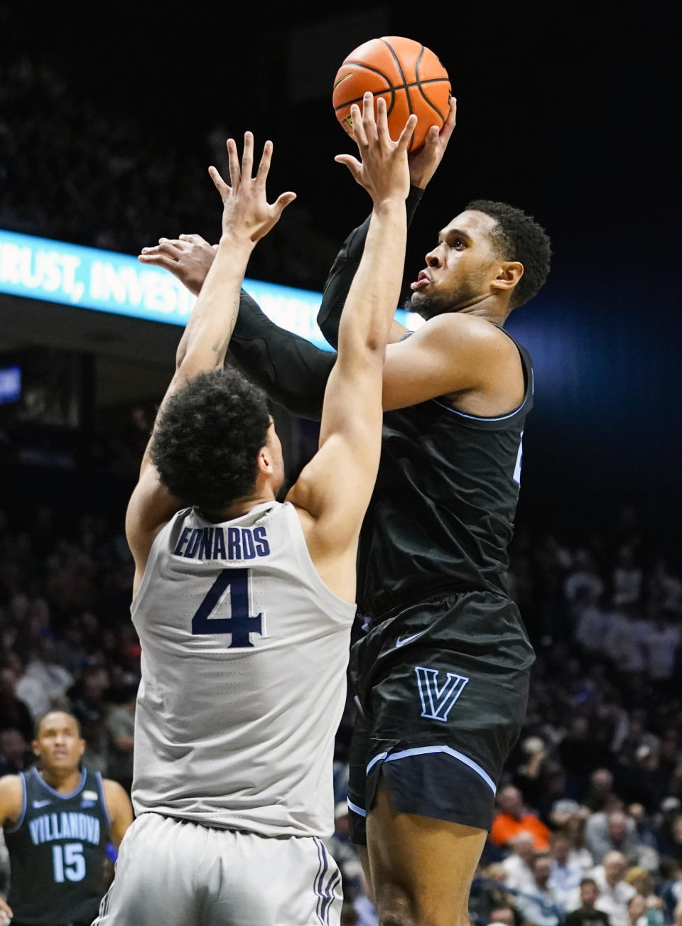 Villanova forward Eric Dixon (43) shoots over Xavier forward Cesare Edwards (4) during the first half of an NCAA college basketball game, Tuesday, Feb. 21, 2023, in Cincinnati. (AP Photo/Joshua A. Bickel)