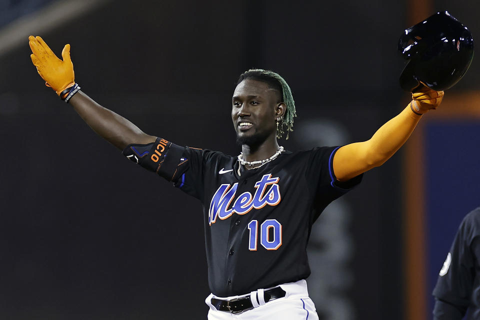 New York Mets' Ronny Mauricio reacts after hitting a double against the Seattle Mariners, his first in the majors, during the third inning of a baseball game Friday, Sept. 1, 2023, in New York. (AP Photo/Adam Hunger)