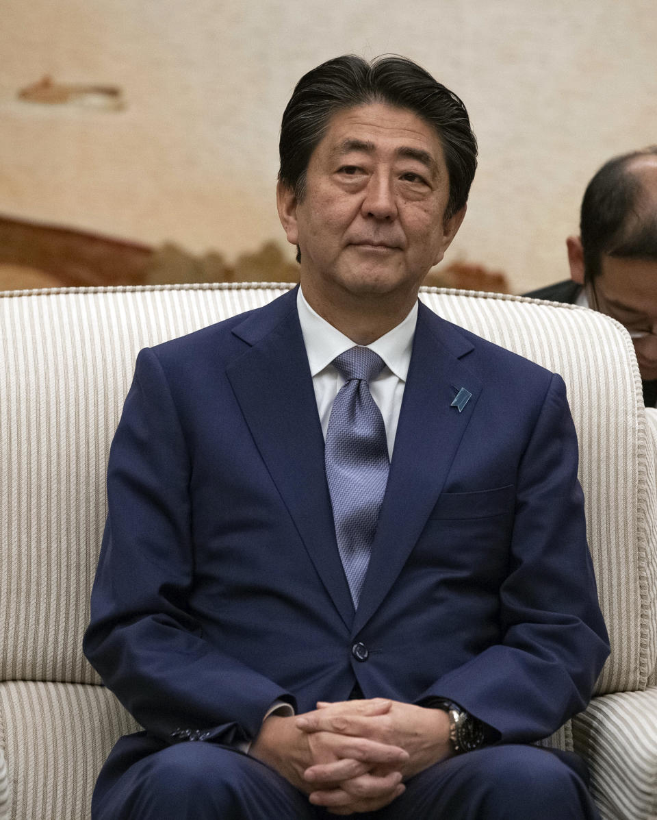 Japanese Prime Minister Shinzo Abe meets Chinese Premier Li Keqiang at the Great Hall of the People in Beijing, Thursday, Oct. 25, 2018. Abe arrived in Beijing on Thursday as both countries try to repair ties that have been riven by disputes over territory, military expansion in the Pacific and World War II history. (Roman Pilipey/Pool Photo via AP)