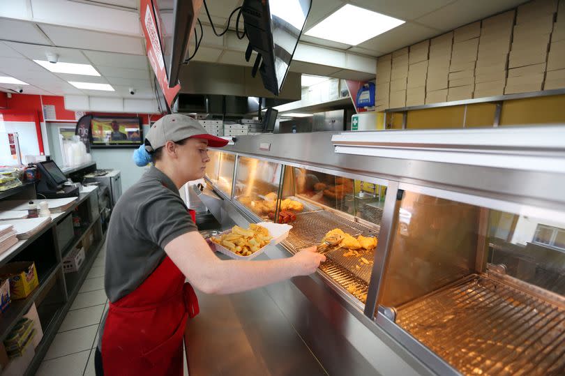 Natalie Hodgson working in Gill's fish and chip shop, Frank street Wallsend