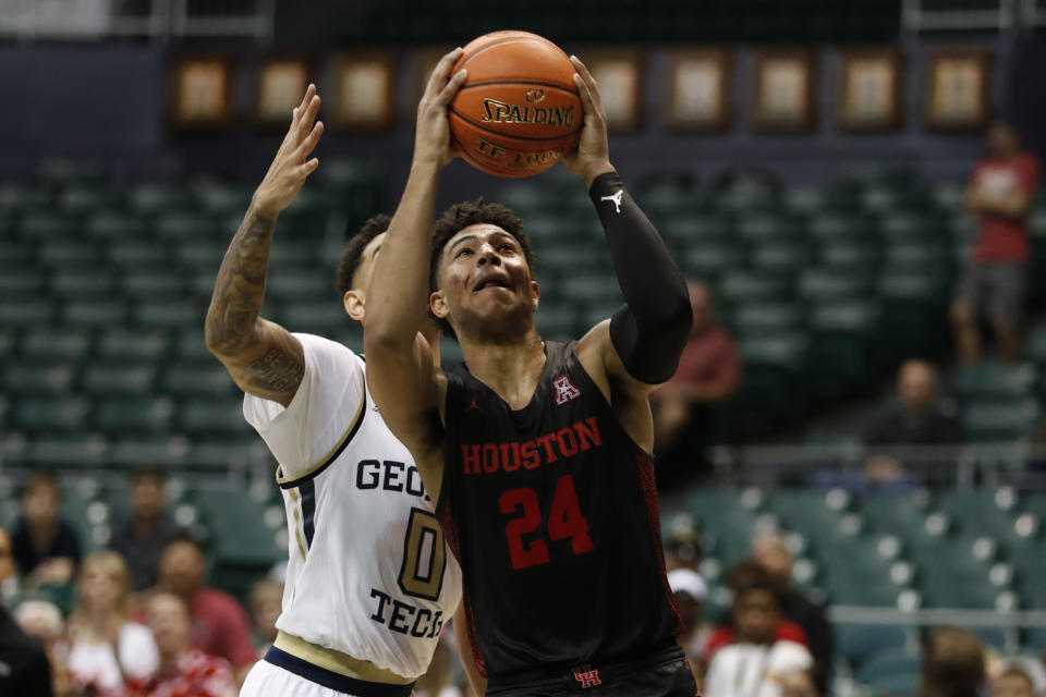 Houston guard Quentin Grimes goes to the basket, in front of Georgia Tech guard Michael Devoe (0) during the second half of an NCAA college basketball game Monday, Dec. 23, 2019, in Honolulu. (AP Photo/Marco Garcia)