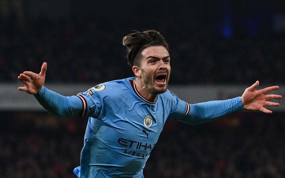 Manchester City's English midfielder Jack Grealish celebrates after scoring his team second goal during the English Premier League football match between Arsenal and Manchester City at the Emirates Stadium in London on February 15, 2023 - GLYN KIRK/AFP via Getty Images