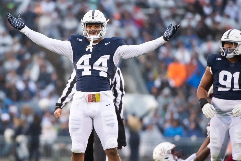 Penn State defensive end Chop Robinson (44) celebrates after sacking Massachusetts quarterback Taisun Phommachanh in the first half of a NCAA football game Saturday, Oct. 14, 2023, in State College, Pa. The Nittany Lions won, 63-0.