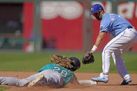 Seattle Mariners' Jake Fraley (28) is forced out at second by Kansas City Royals second baseman Whit Merrifield (15) to get the second out of a double play hit into by Jake Bauers during the fifth inning of a baseball game Sunday, Sept. 19, 2021, in Kansas City, Mo. (AP Photo/Charlie Riedel)