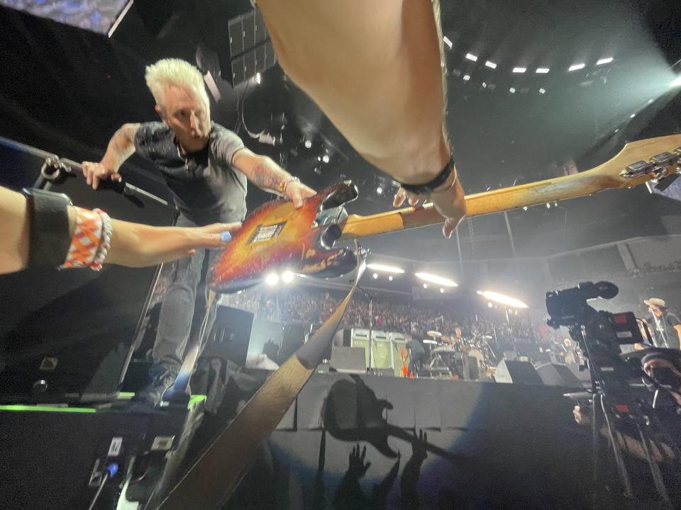 Pearl Jam lead guitarist Mike McCready shows off his vintage 1960 Stratocaster during the band's first of two Austin concerts on Monday. In all, the band played 50 songs across the two nights with only repeat performance: their 1992 classic "Alive."