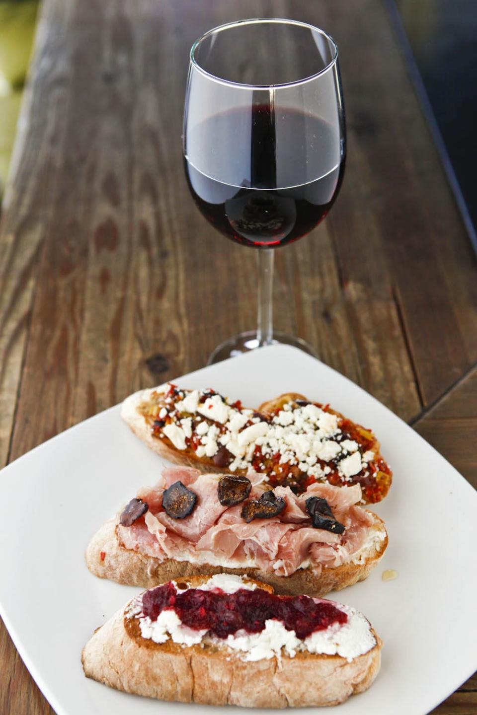 A selection of bruschetta served with wine at 32 Shea in Phoenix.