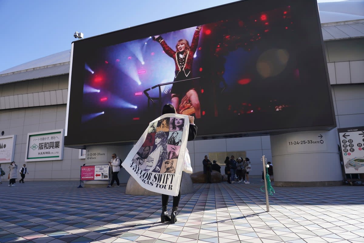 A fan arrives at the Tokyo Dome, for the Taylor Swift concert, as part of the ‘Eras Tour’ on 7 February (Copyright 2024 The Associated Press. All rights reserved)
