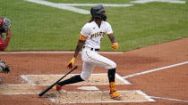 Pittsburgh Pirates' Oneil Cruz follows through on two-run double off Cincinnati Reds starting pitcher Luis Cessa during the second inning of a baseball game in Pittsburgh, Wednesday, Sept. 28, 2022. (AP Photo/Gene J. Puskar)