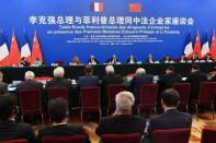 Chinese Premier Li Keqiang and French Prime Minister Edouard Philippe meet with French business leaders and entrepreneurs at the Great Hall of the People in Beijing, China June 25, 2018. Greg Baker/Pool via REUTERS