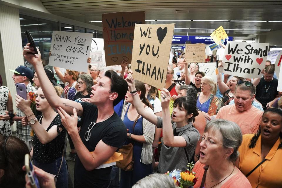 Supporters greet Ilhan Omar as she arrives home in Minneapolis (AP)