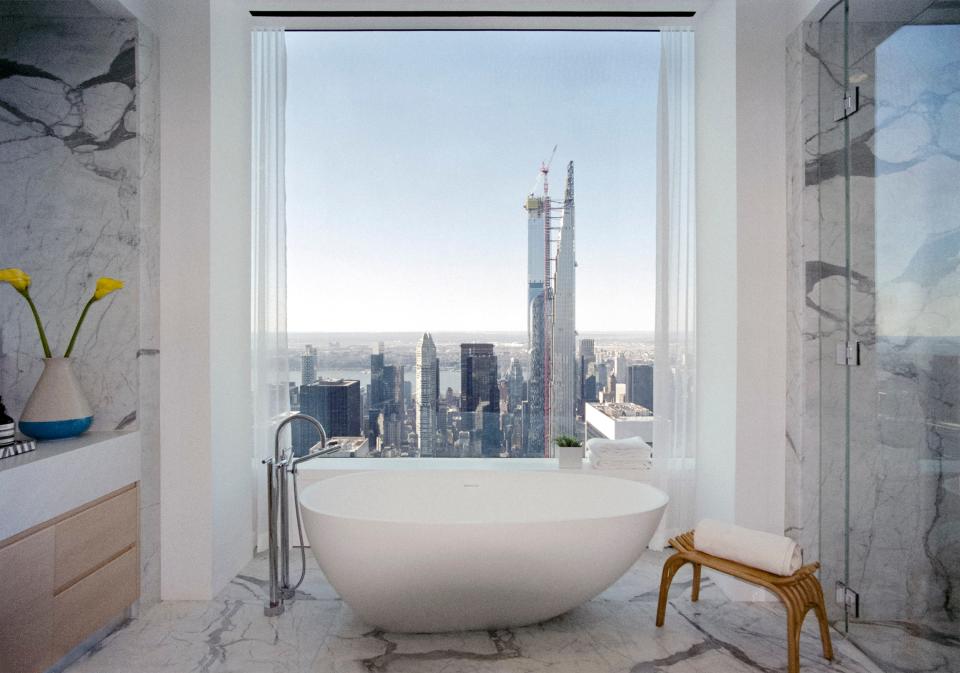 Western view from a bathroom from one of the upper floor staged apartments at Rafael Viñoly’s 432 Park Avenue.