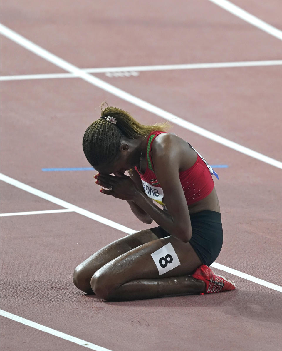 Beatrice Chepkoech, of Kenya, reacts after winning the the women's 3000 meter steeplechase final at the World Athletics Championships in Doha, Qatar, Monday, Sept. 30, 2019. (AP Photo/Nick Didlick)