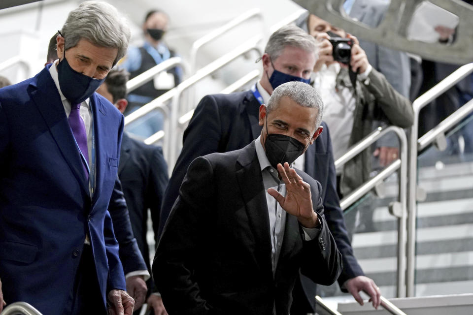 Former U.S. President Barack Obama is accompanied by John Kerry, United States Special Presidential Envoy for Climate, left, as he arrives at an event during the COP26 U.N. Climate Summit in Glasgow, Scotland, Monday, Nov. 8, 2021. The U.N. climate summit in Glasgow is entering it's second week as leaders from around the world, are gathering in Scotland's biggest city, to lay out their vision for addressing the common challenge of global warming. (Jane Barlow/PA via AP)