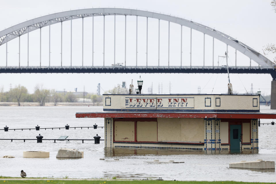 The Levee Inn is partially submerged by the rising Mississippi River, Monday, April 24, 2023, Davenport, Iowa. (Niko Frazer / Quad City Times via AP)