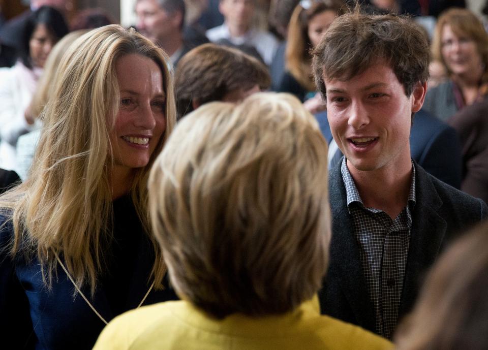 Democratic presidential candidate Hillary Clinton greets Laurene Powell Jobs, the widow of Steve Jobs, left, and her son Reed Jobs after speaking about counterterrorism, Wednesday, March 23, 2016, at the Bechtel Conference Center at Stanford University in Stanford, Calif.