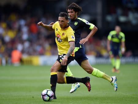 Football Soccer Britain - Watford v Arsenal - Premier League - Vicarage Road - 27/8/16 Watford's Jose Holebas in action with Arsenal's Mohamed Elneny Reuters / Hannah McKay Livepic