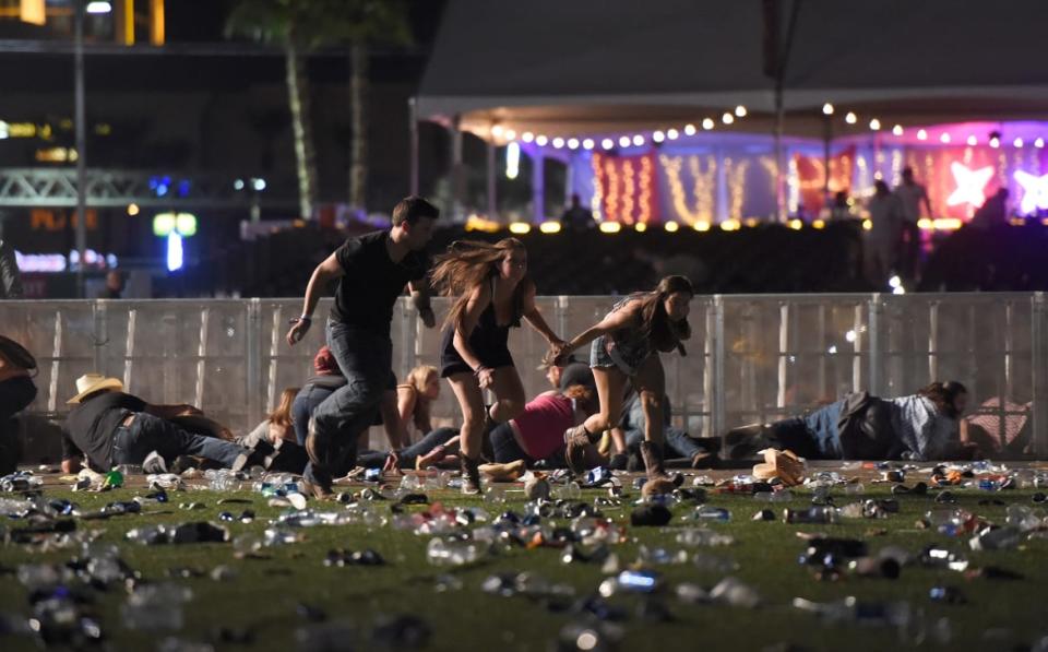 <div class="inline-image__caption"><p>People run from the Route 91 Harvest country music festival after a gunman opened fire on the crowd on Oct. 1, 2017, in Las Vegas.</p></div> <div class="inline-image__credit">David Becker/Getty</div>
