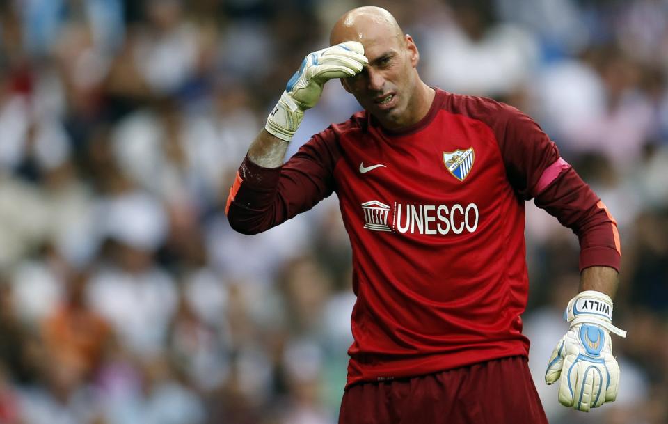 Malaga's goalkeeper Wilfredo Caballero reacts during the Spanish first division soccer match against Real Madrid at Santiago Bernabeu stadium in Madrid