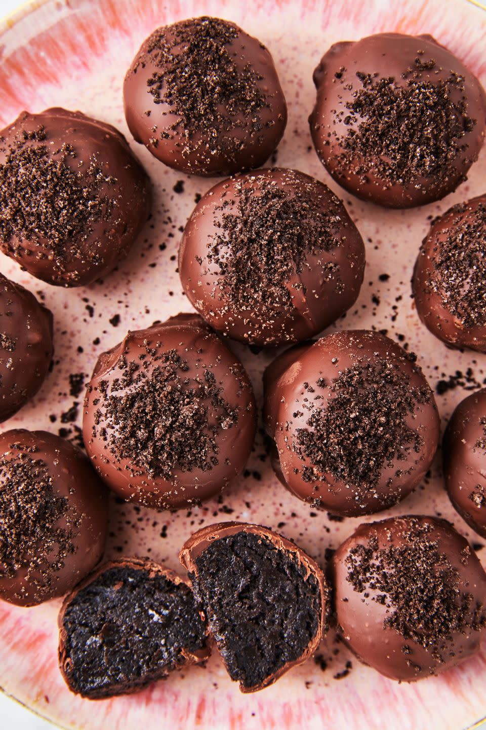<p>Oreo lovers, be prepared to eat a whole batch of these. These cookie balls are essentially <a href="https://www.delish.com/cooking/recipe-ideas/recipes/a48823/oreo-truffles-recipe/" rel="nofollow noopener" target="_blank" data-ylk="slk:truffles;elm:context_link;itc:0;sec:content-canvas" class="link ">truffles</a>. You simply crush up Oreos (we like using a food processor, but the old zip-top bag and rolling pin definitely works), mix them up with cream cheese, and then dunk those balls into <a href="https://www.delish.com/cooking/recipe-ideas/a25658627/how-to-melt-chocolate/" rel="nofollow noopener" target="_blank" data-ylk="slk:melted chocolate;elm:context_link;itc:0;sec:content-canvas" class="link ">melted chocolate</a>.</p><p>Get the <strong><a href="https://www.delish.com/cooking/recipe-ideas/a25622407/best-oreo-cookie-balls-recipe/" rel="nofollow noopener" target="_blank" data-ylk="slk:Oreo Cookie Balls recipe;elm:context_link;itc:0;sec:content-canvas" class="link ">Oreo Cookie Balls recipe</a></strong>.</p>