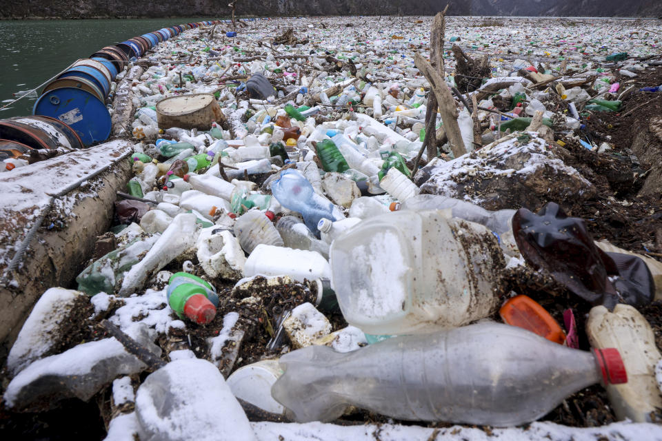 Waste float in the Drina river near Visegrad, Bosnia, Wednesday, Jan. 10, 2024. Tons of waste dumped in poorly regulated riverside landfills or directly into the rivers across three Western Balkan countries end up accumulating during high water season in winter and spring, behind a trash barrier in the Drina River in eastern Bosnia. (AP Photo/Armin Durgut)