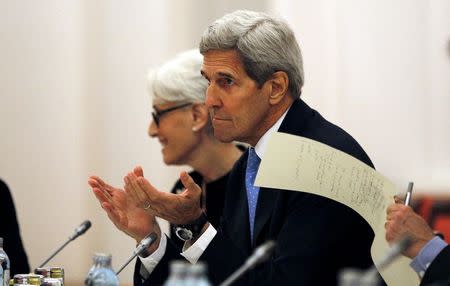 U.S. Secretary of State John Kerry meets with foreign ministers and representatives from Germany, France, China, Britain, Russia and the European Union during nuclear talks at a hotel in Vienna, Austria July 10, 2015. REUTERS/Carlos Barria