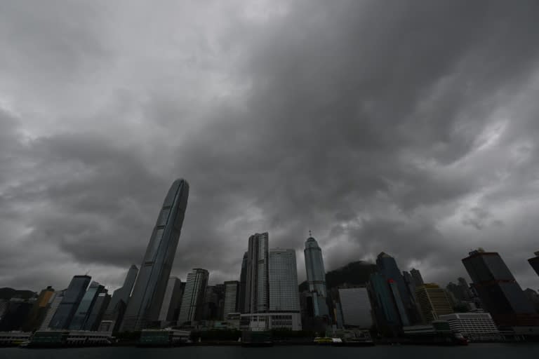 Hong Kong's stock exchange will implement new rules in September to continue trading through inclement weather (Peter PARKS)