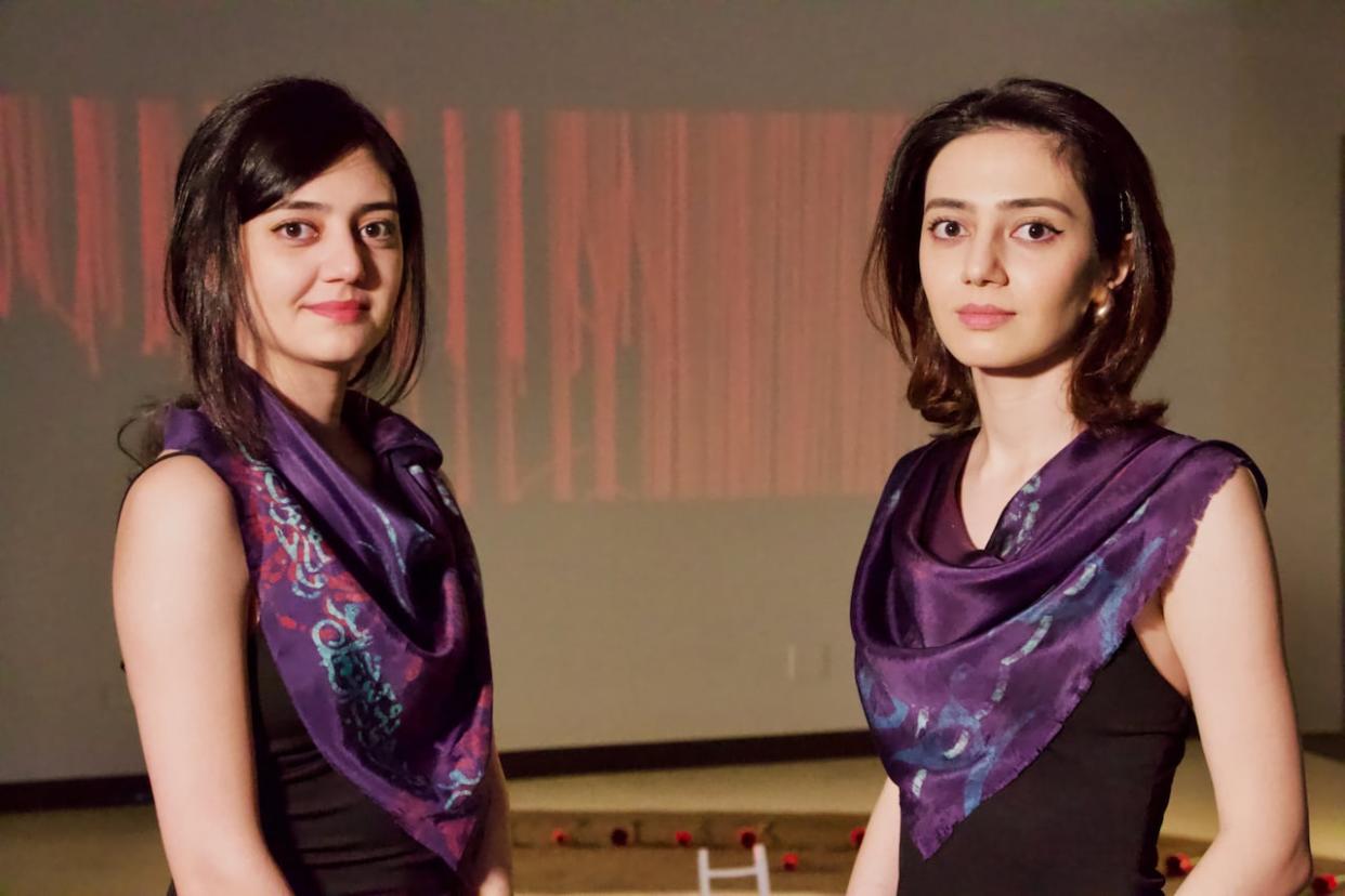 Shamim and Shima Aghaaminiha say artists couldn't make political statements with their work in Iran, but now that they live in Canada they've found a way to express their discontent with the Iranian regime.  (Natascia Lypny/CBC News - image credit)