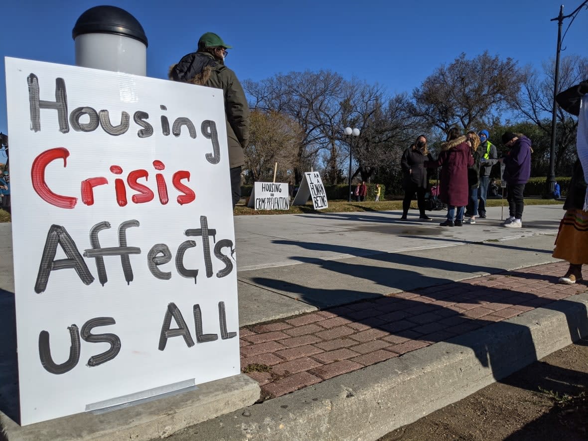 A sign at a protest in Regina in October demanding changes to Saskatchewan Income Support (SIS) program. (Dayne Patterson/CBC - image credit)