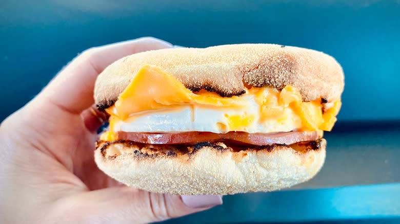 egg mcmuffin being held