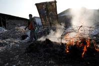 The Wider Image: Cash for trash: Indonesia village banks on waste recycling