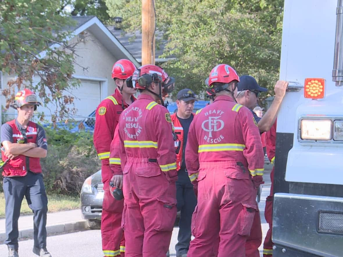 Crews were on scene in northwest Calgary working to recover the body of a 27-year-old man on June 8, 2023. (Tom Ross/CBC - image credit)