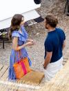 <p>Collins sported a frilly blue dress and bright orange and pink tote while filming in Saint-Jean-Cap-Ferrat on May 4. </p>