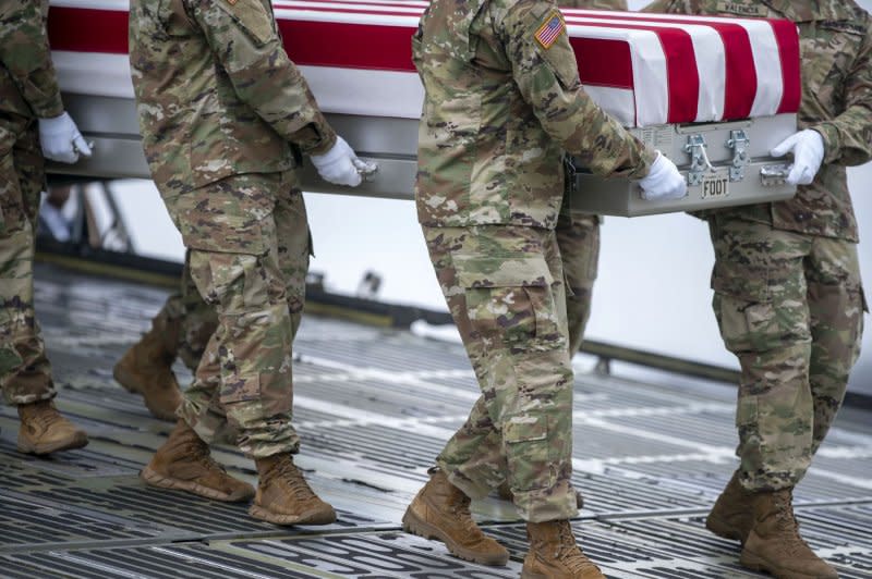 A U.S. Army carry team carries the transfer case containing the body of Army Sgt. Breonna Moffett during a dignified transfer at Dover Air Force Base in Dover, Del., on Friday. Photo by Bonnie Cash/UPI