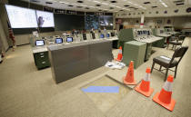 Work continues inside the mission control room being restored to replicate the Apollo mission era for the 50th anniversary of the Apollo moon landing at the NASA Johnson Space Center Monday, June 17, 2019, in Houston. (AP Photo/Michael Wyke)