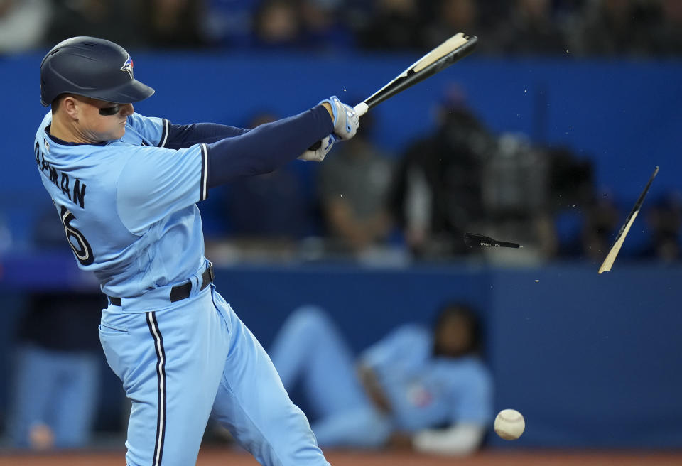 Toronto Blue Jays third baseman Matt Chapman (26) breaks his bat on a foul ball against the Seattle Mariners during sixth inning of a baseball game in Toronto, Monday, May 16, 2022. (Nathan Denette/The Canadian Press via AP)