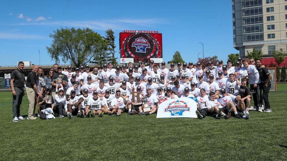 The Army men's lacrosse team poses for a championship photo after beating Loyola., Md., in Sunday's Patriot League finals in Boston. ARMY ATHLETICS