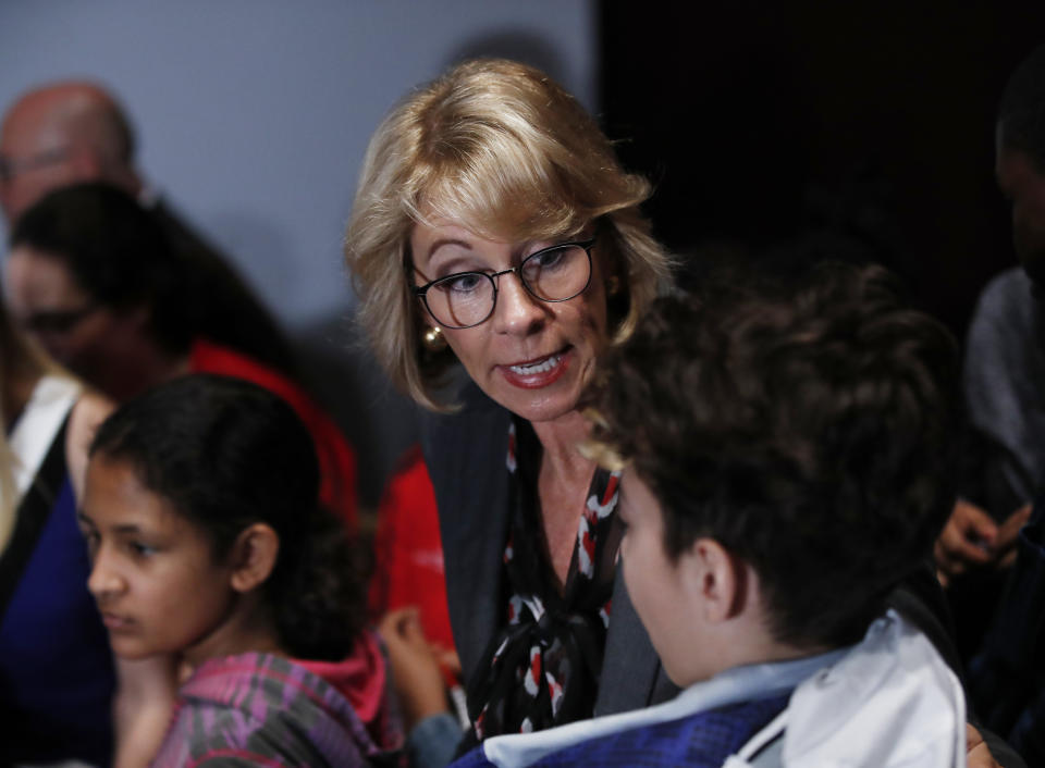 Education Secretary Betsy DeVos talks to students at the Smithsonian's National Air and Space Museum in Washington, Tuesday, March 28, 2017, during an event to celebrate Women's History Month. (AP Photo/Manuel Balce Ceneta)