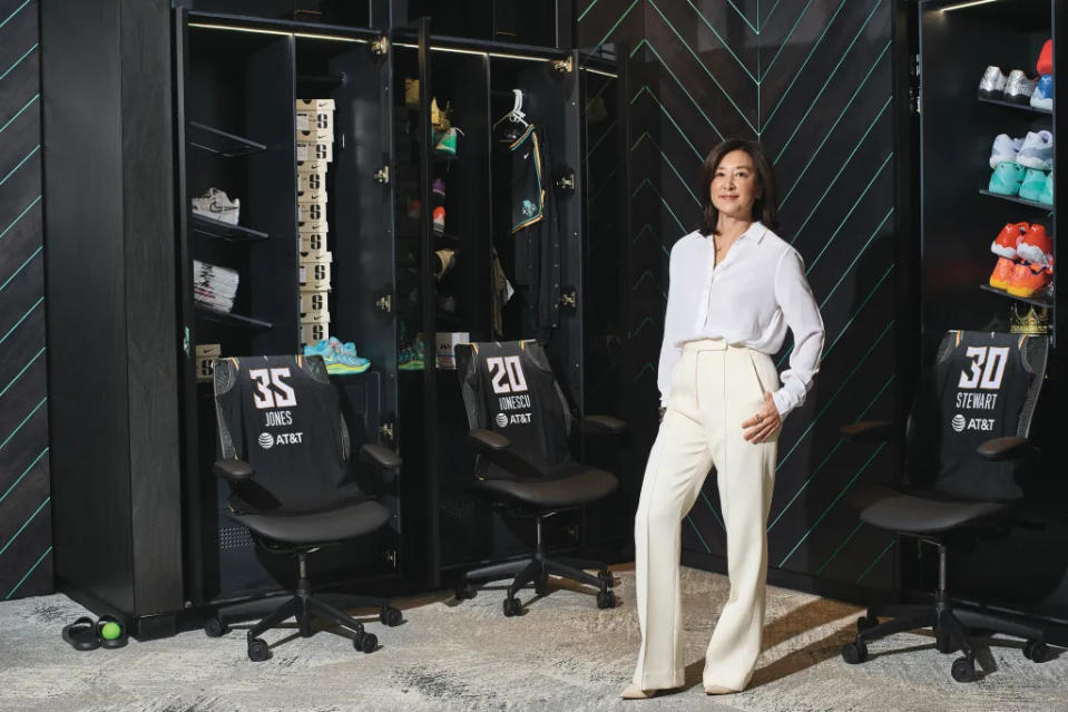 Liberty owner Clara Wu poses in the WNBA team's locker room