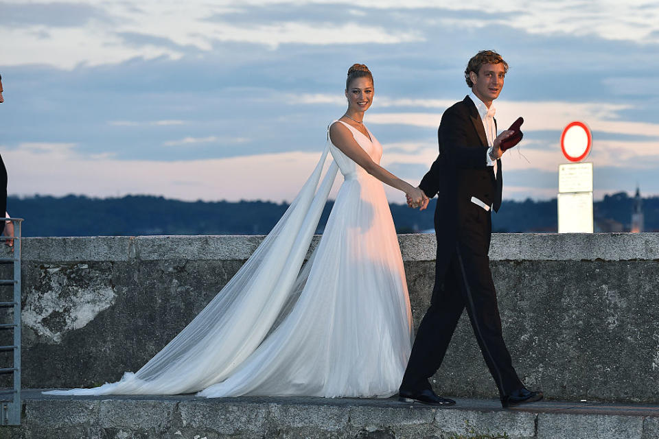 Pictured at her wedding on August 1, 2015 in Angera, Italy in one of her four couture wedding dresses. (Getty Images)