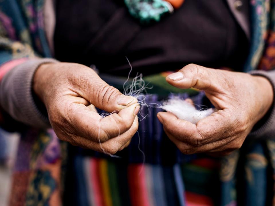 Dehairing the cashmere harvest involves removing all the longer coarser guard hairs in the fibre – a process that must be carried out by hand (Paddy Dowling)