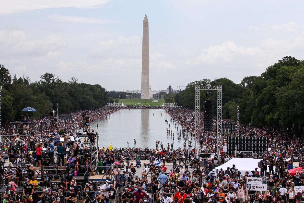 Crowds descend upon the National Mall during the Commitment March at the Lincoln Memorial: Getty Images