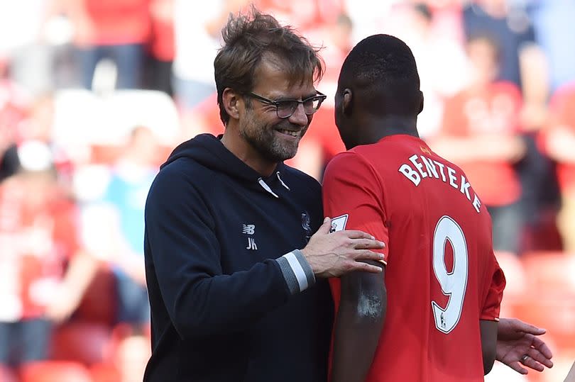 Jurgen Klopp celebrates with Christian Benteke at the end of the Barclays Premier League match between Liverpool and Watford at Anfield in May 2016