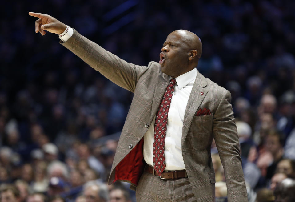 St. John's head coach Mike Anderson directs his team against Xavier during the first half of an NCAA college basketball game, Sunday, Jan. 5, 2020, in Cincinnati. (AP Photo/Gary Landers)