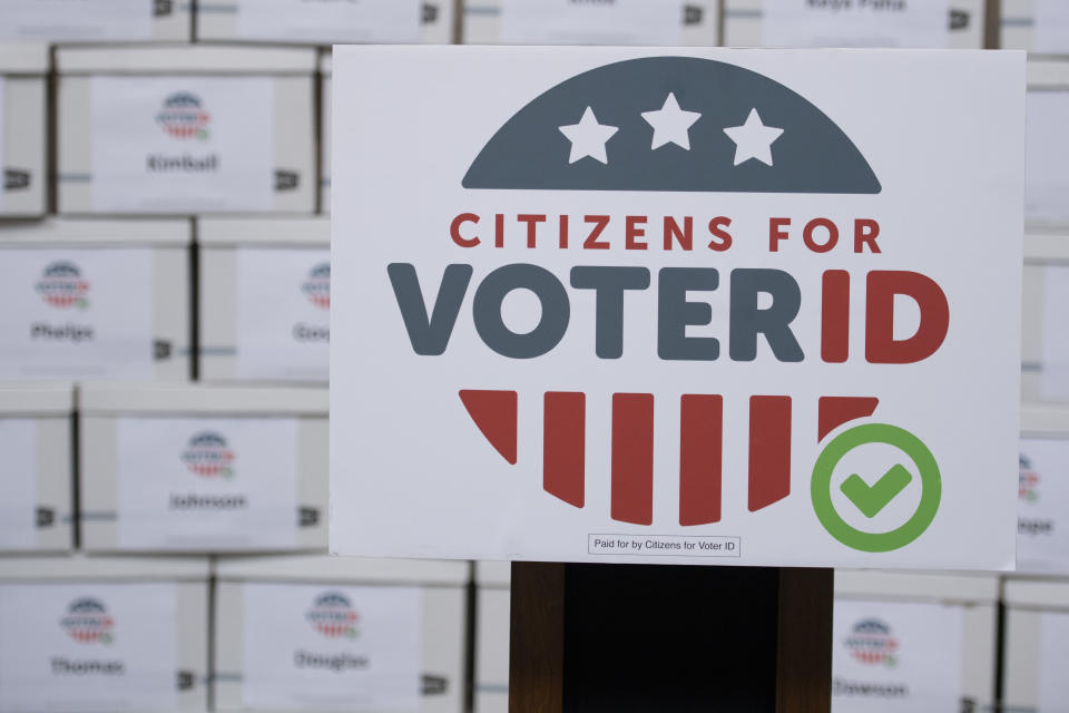 FILE - Boxes of signatures are displayed after a new conference hosted by Citizens for Voter ID at the Nebraska Capitol building on July 7, 2022, in Lincoln, Neb. Voters in several states are deciding measures that could affect the way they cast ballots in future elections. While some measures would expand access to voting, proposals elsewhere would impose new identification requirements to cast ballots or raise the threshold to pass citizen initiatives. (Noah Riffe/Lincoln Journal Star via AP)