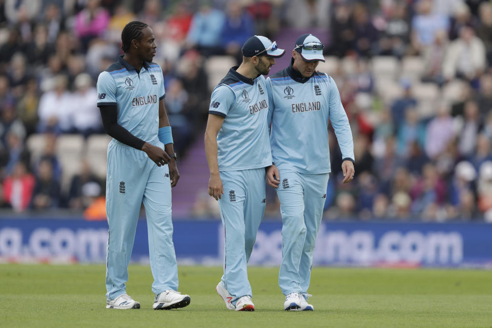 England's Jason Roy, right, walks off the field of play with a leg injury during the Cricket World Cup match between England and West Indies at the Hampshire Bowl in Southampton, England, Friday, June 14, 2019. (AP Photo/Matt Dunham)